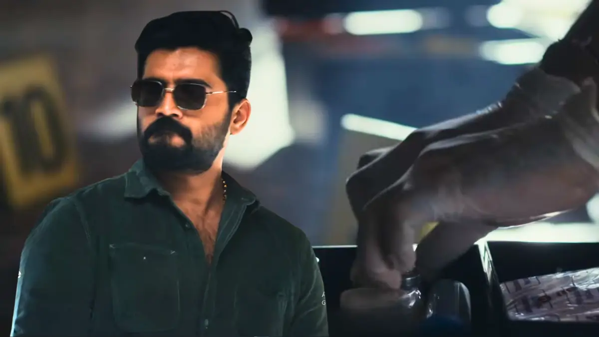 Vikram On Duty series: Nikhil Maliyakkal as tough cop Vikram in green shirt and sunglasses at shop counter, intense crime thriller moment