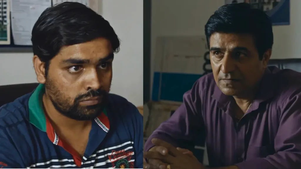 Two Indian men in serious discussion indoors: bearded young man in blue striped polo shirt, older man in maroon shirt looking thoughtful