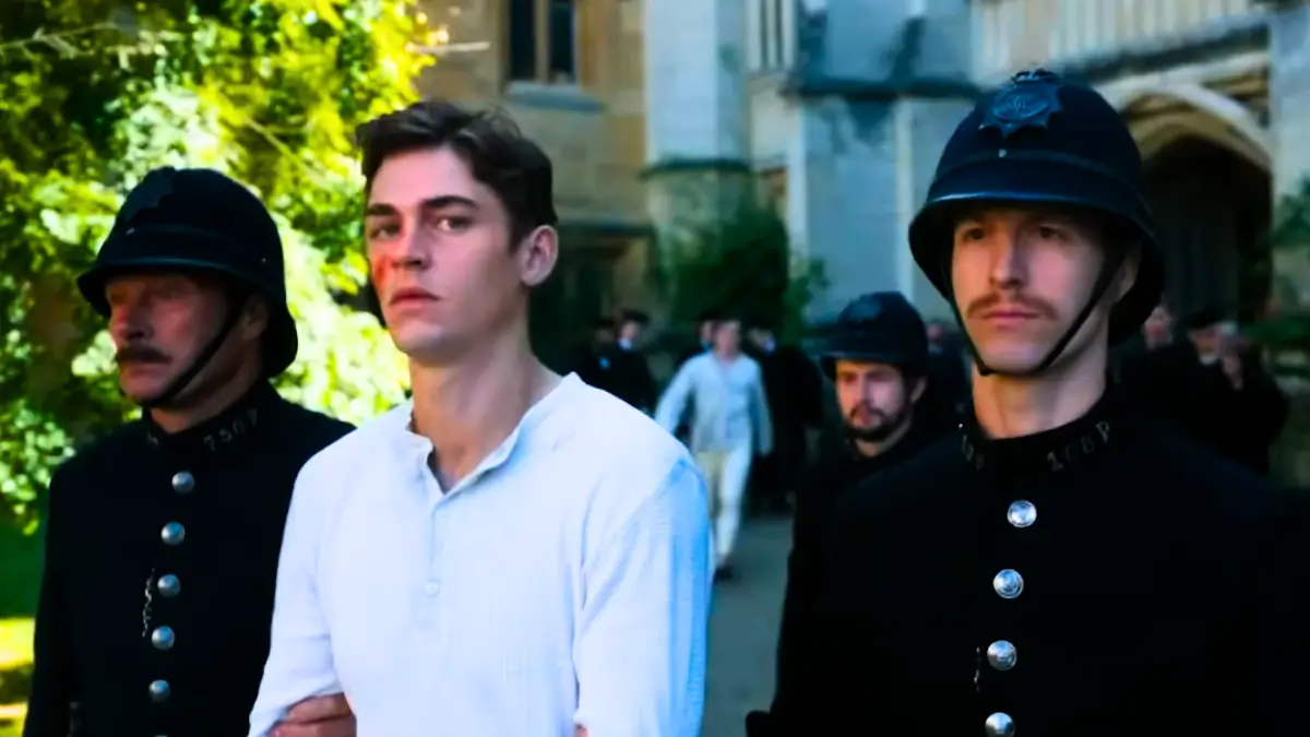 Young Sherlock 2026 series scene: Hero Fiennes Tiffin as young Holmes arrested by Victorian police outside Oxford college