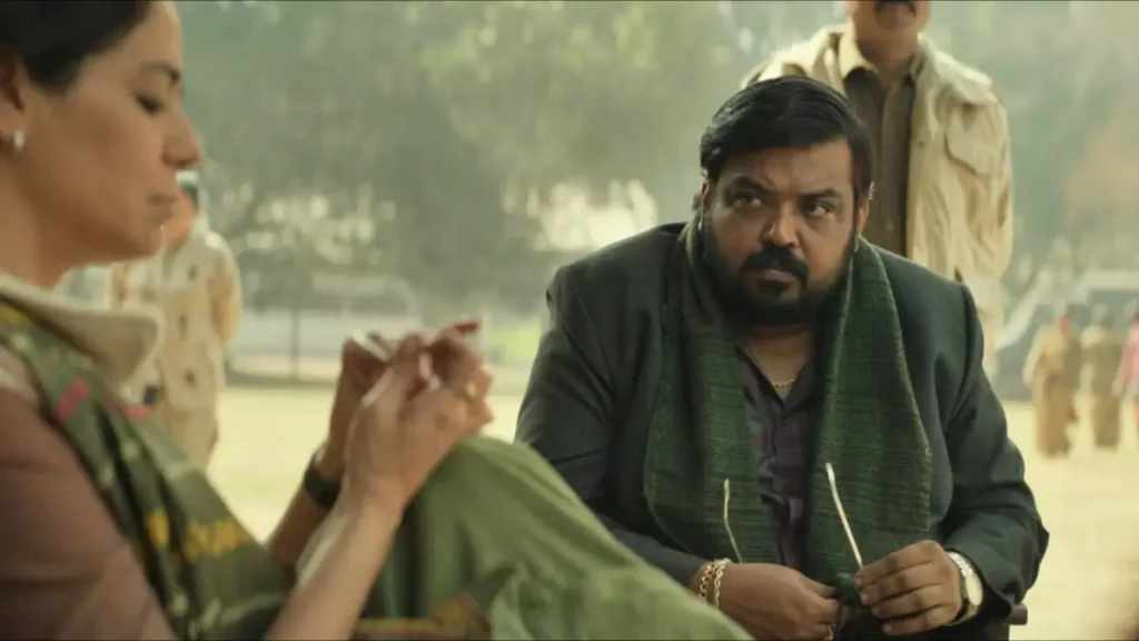 Subedar Movie Review: अनिल कपूर की 'सूबेदार' प्राइम वीडियो पर रिलीज, जानें कैसी है यह एक्शन थ्रिलर फिल्म? 1 Subedaar movie scene: Man in green shawl sitting on ground in park talking intensely to woman, emotional family moment